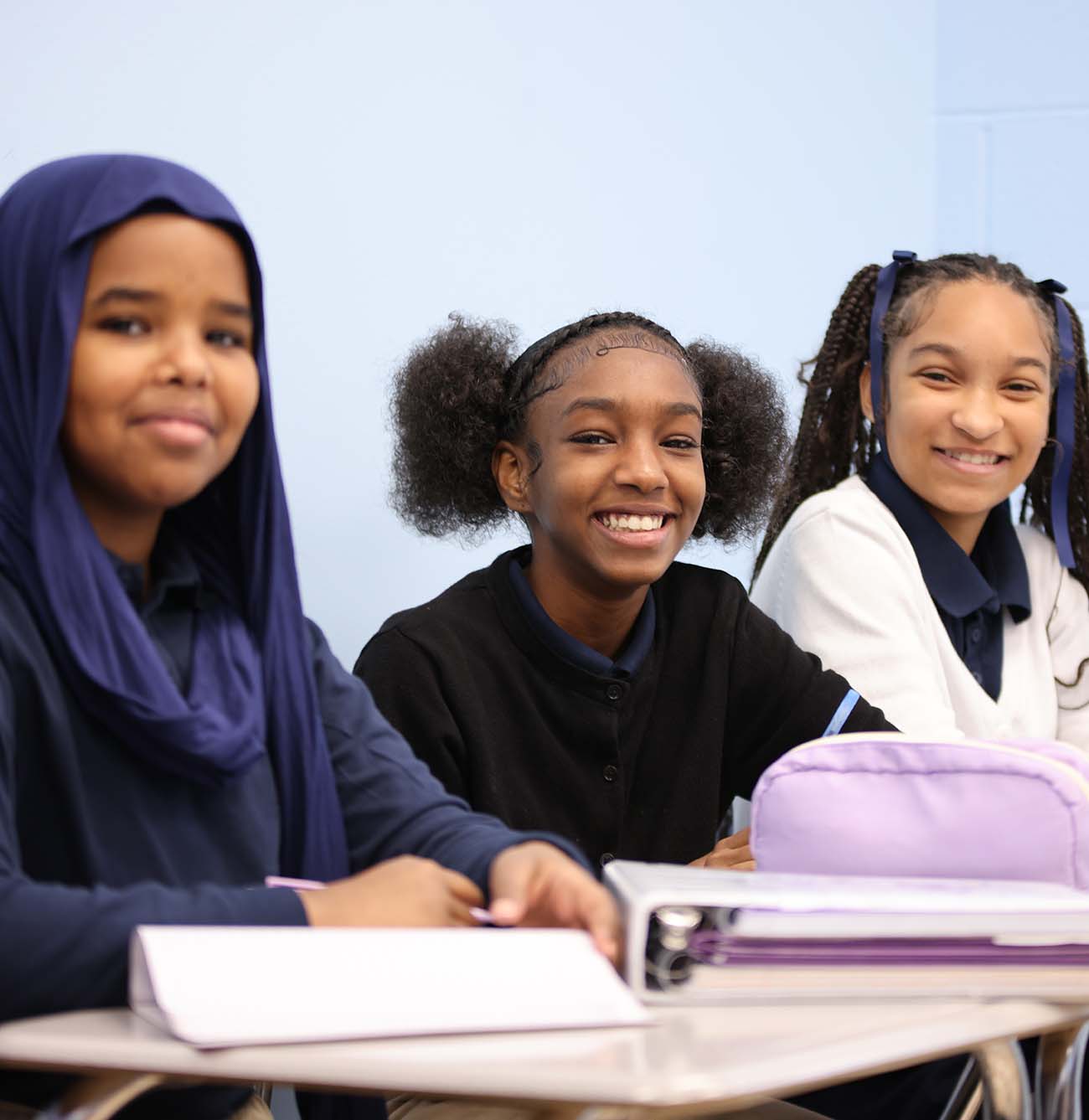 HSA Columbus Middle student drawing at a desk in a classroom setting