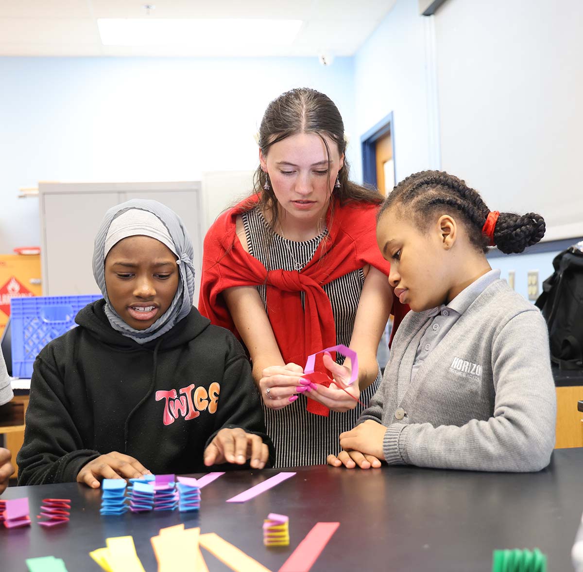 HSA Columbus Middle Teacher and student interacting at a classroom desk