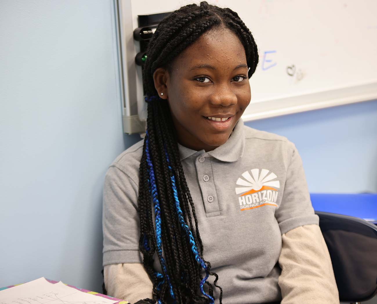 Smiling children together outdoors.